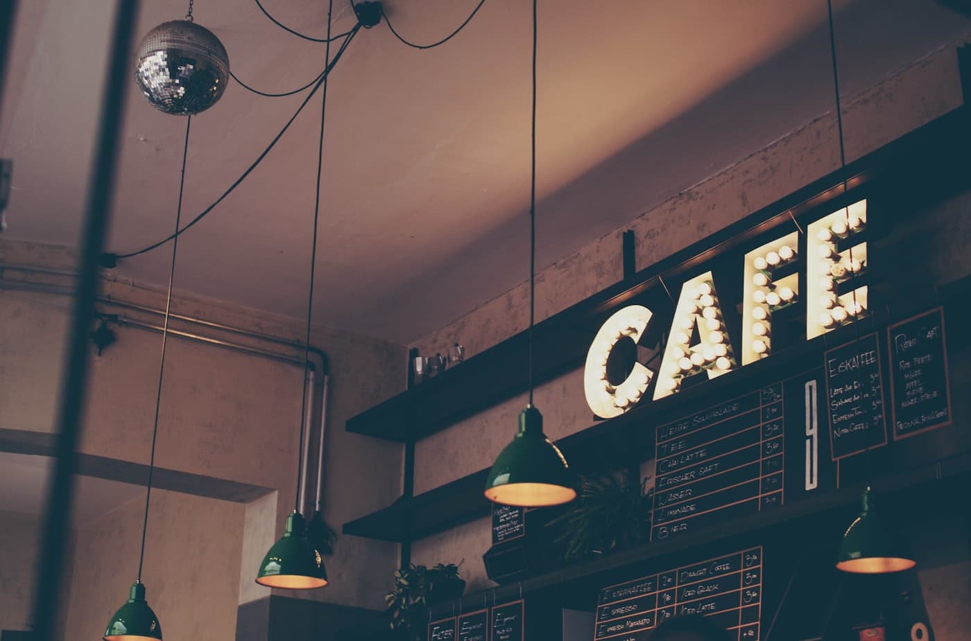 Modern vibrant cafe with people using phones